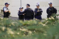 Police patrol a park where Blockade Australia protest organizer Sally-Anne Brown held a press conference in Sydney, Australia, Monday, June 27, 2022. News of Australia’s increasing greenhouse gas emissions comes as climate activist group Blockade Australia kicked off a weeklong campaign of disruption in Sydney by shutting down the downtown Sydney Harbor Tunnel during Monday morning’s peak traffic period. (AP Photo/Mark Baker)