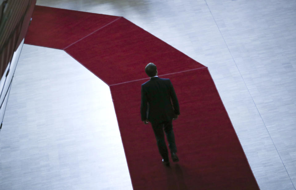 French President Emmanuel Macron arrives for an EU summit in Brussels, Thursday, Dec. 12, 2019. European Union leaders gather for their year-end summit and will discuss climate change funding, the departure of the UK from the bloc and their next 7-year budget. (AP Photo/Francisco Seco)