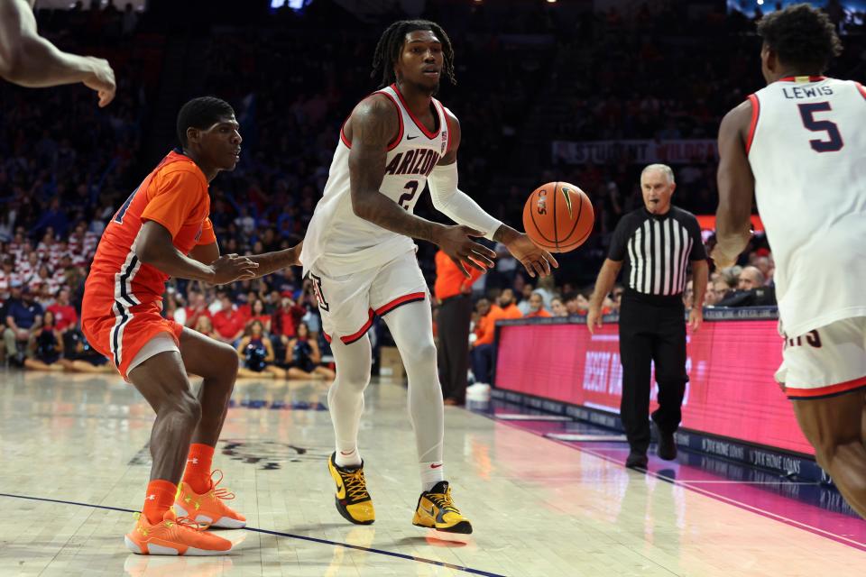 Nov 6, 2023; Tucson, Arizona, USA; Arizona Wildcats guard Caleb Love (2) makes a pass to guard KJ Lewis (5) against Morgan State Bears guard Ahmarie Simpkins (11) during the second half at McKale Center. Mandatory Credit: Zachary BonDurant-USA TODAY Sports