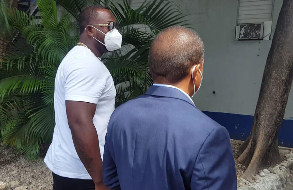 Minnesota Twins slugger Miguel Sano, right, arrives to the Prosecutor's Office accompanied by his lawyer, in his hometown San Pedro de Macoris, Dominican Republic, Thursday, June 25, 2020. Authorities in the Dominican Republic have opened an investigation into allegations the first baseman participated in the kidnapping and beating of a man in his homeland. Sano, who signed a three-year, $30 million contract with the Twins in January, denies the allegation and has said he’s being blackmailed. (AP Photo/Martin Adames)