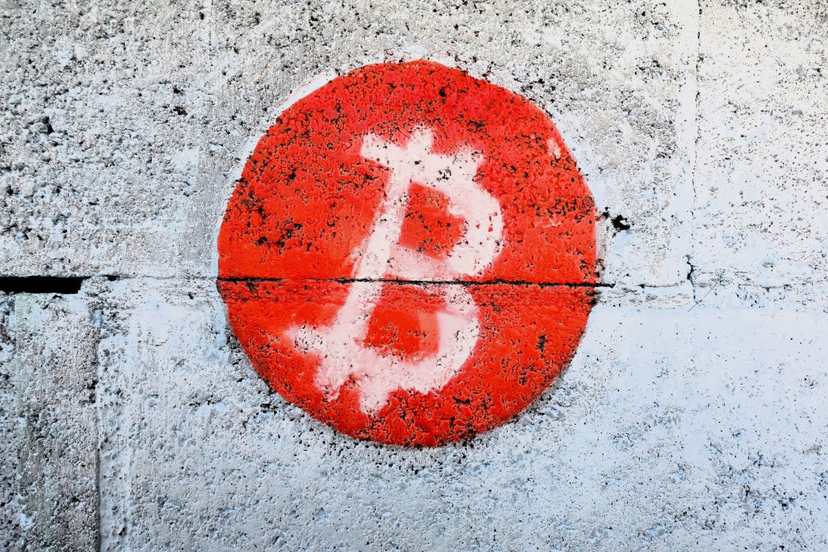 A bitcoin logo is seen on the wall of a fishermen’s house in Playa Blanca, in the municipality of Conchagua, El Salvador, on 11 January, 2024 (Getty Images)