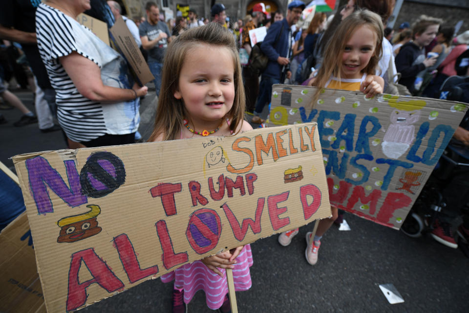 <p>Young girls hold anti-Trump signs during a protest in Edinburgh, Scotland, while the U.S. president visits Trump Turnberry Luxury Collection Resort on his visit to the United Kingdom, July 14, 2018. (Photo: Jeff J. Mitchell/Getty Images) </p>