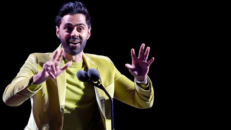 Hasan Minhaj performing stand-up comedy