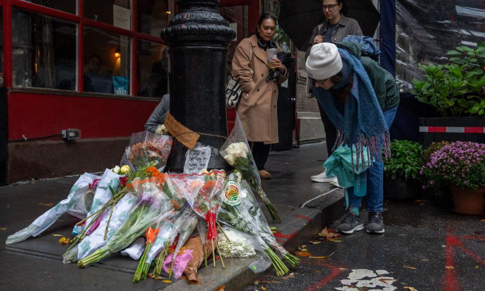 Floral tributes for Matthew Perry outside the apartment building which was used as the exterior shot in the TV show Friends, New York 29 October 2023.