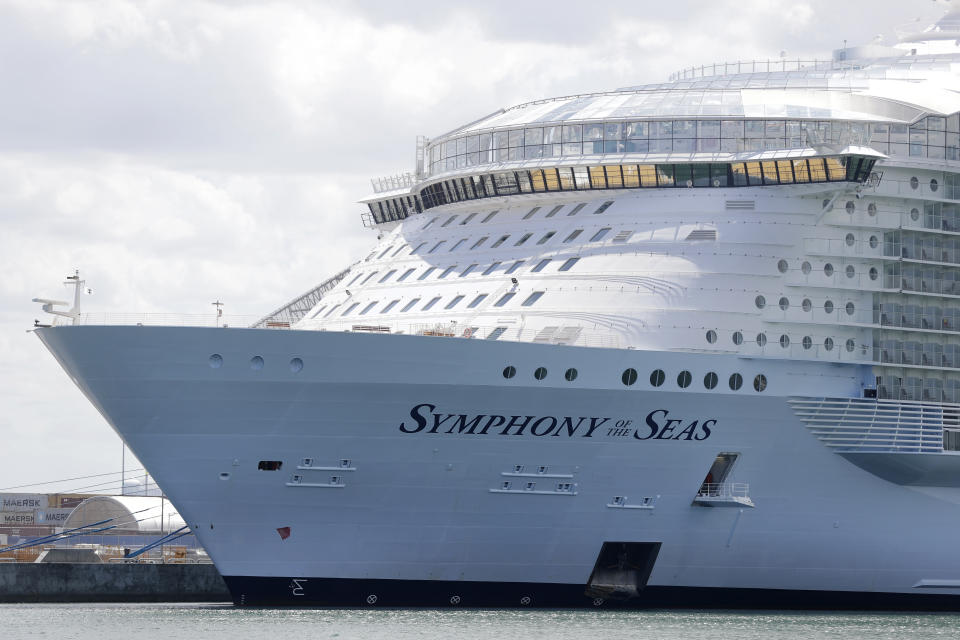 FILE - In this Wednesday, May 20, 2020, file photo, the Symphony of the Seas cruise ship is shown docked at PortMiami, in Miami. Florida is threatening to sue the federal government if it doesn't lift its pandemic ban on cruise lines using U.S. ports. Gov. Ron DeSantis and state Attorney General Ashley Moody said Friday, March 26, 2021, that the state is being harmed economically by the industry's U.S. shutdown. (AP Photo/Wilfredo Lee, File)