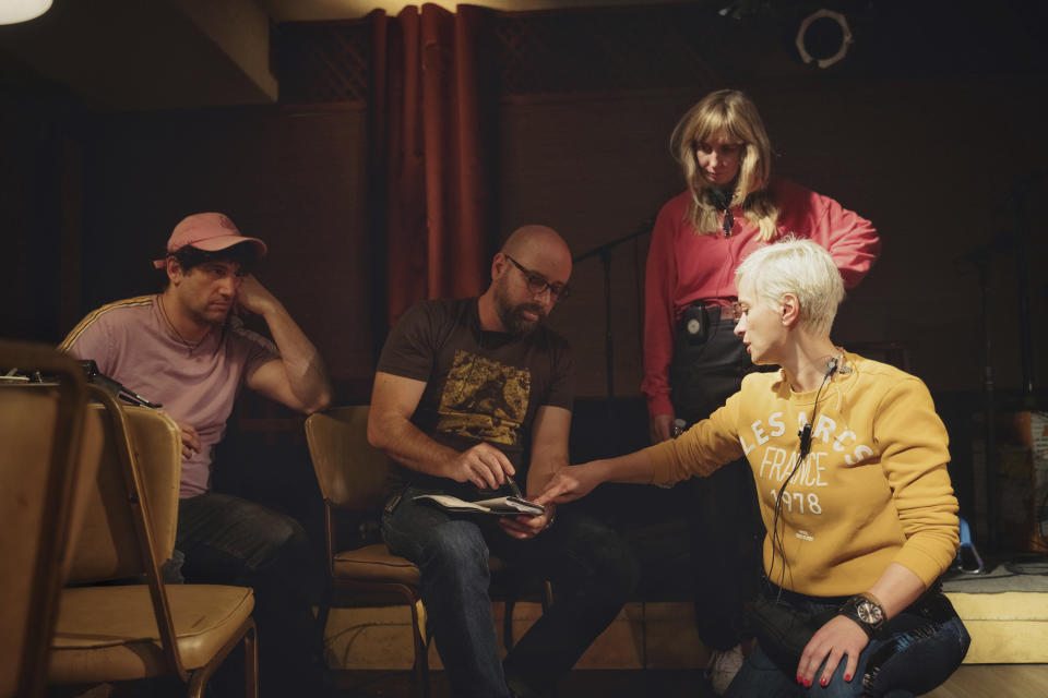 This photo provided by Jack Caswell shows director Adam Egypt Mortimer, from left, first assistant director Borjan Jovanovich, producer Kim Sherman, and director of photography Halyna Hutchins on the set of "Archenemy" on Jan. 8, 2020, in Los Angeles. Hutchins was fatally shot by Alec Baldwin Thursday on the New Mexico set of the western film "Rust." Authorities continue to investigate the shooting but there are no allegations of wrongdoing by Baldwin. (Jack Caswell via AP)