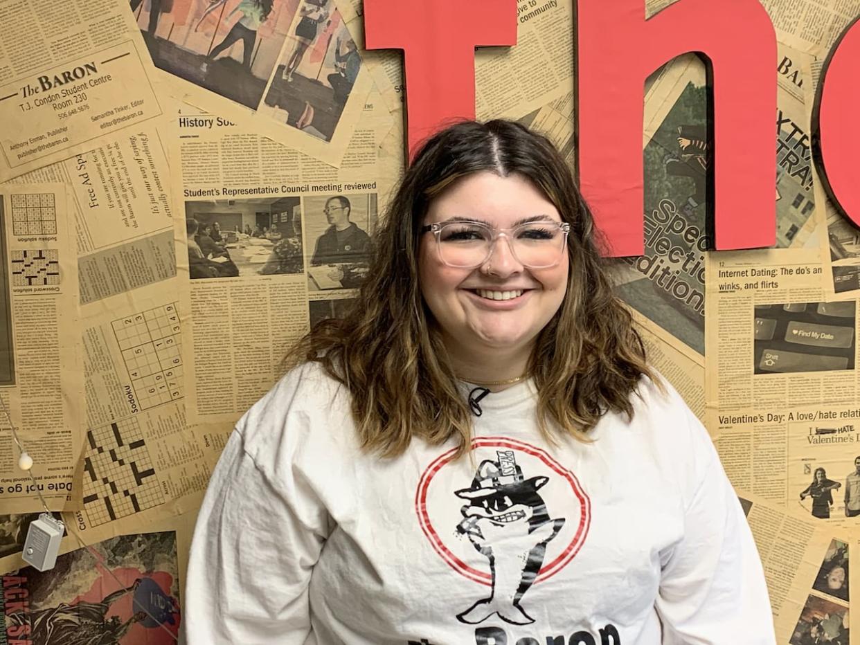 Emily Wheaton is trying to reconnect students at UNB in Saint John with the campus newspaper, and she's doing it by putting physical copies into their hands. (Nipun Tiwari/CBC - image credit)