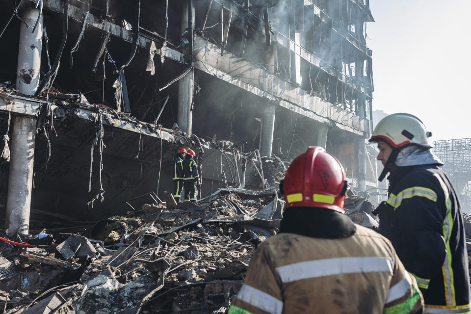 KYIV, UKRAINE - MARCH 21: Firefighters work at site after Russian attacks struck a shopping mall, in Kyiv, Ukraine on March 21, 2022. It is reported that, 8 people were killed in the Russian attack on shopping mall. (Photo by Diego Herrera Carcedo/Anadolu Agency via Getty Images)