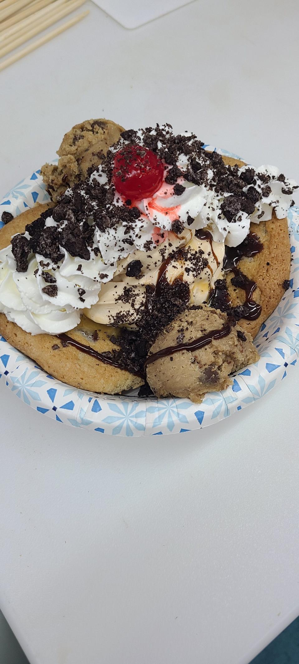 The Cookie Dough Explosion features a chocolate chip cookie topped with a salted caramel gelato, with scoops of cookie dough covered in hot fudge, caramel, whipped cream and Oreos.