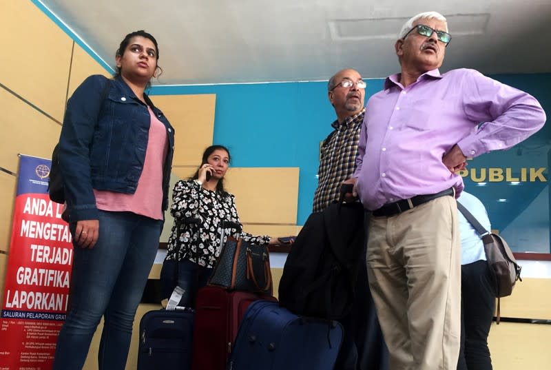 Garima Sethi, the wife of Bhavye Suneja, a pilot of the crashed Lion Air flight JT610, speaks on a phone ahead of the briefing to the families of victims on the final report on the crash at the Transport Ministry in Jakarta