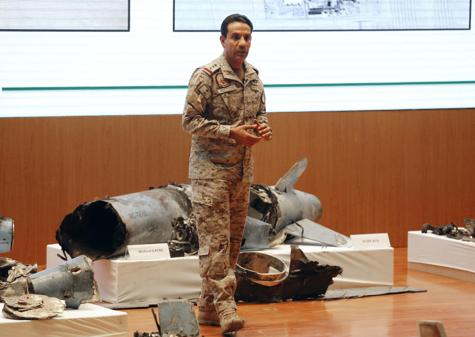 Saudi military spokesman Col. Turki al-Malki displays what he describes as an Iranian cruise missile and drones used in an attack this weekend that targeted the heart of Saudi Arabia's oil industry, during a press conference in Riyadh, Saudi Arabia, Wednesday, Sept. 18, 2019. Though Yemen's Houthi rebels claimed the assault, the U.S. alleges Iran was behind it. (AP Photo/Amr Nabil)