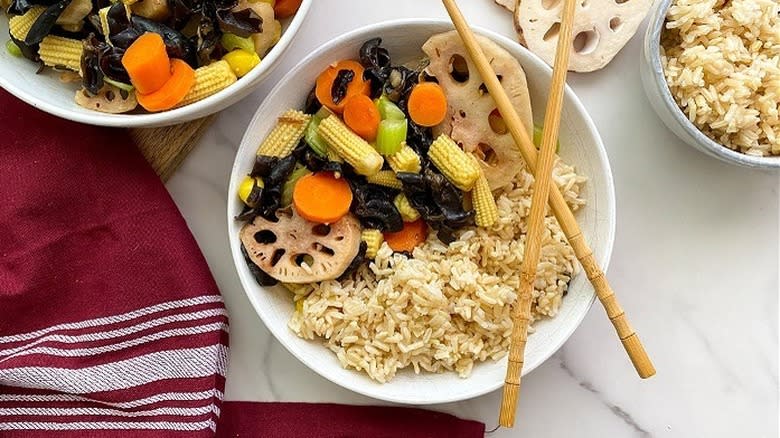 lotus root stir fry with rice in a bowl