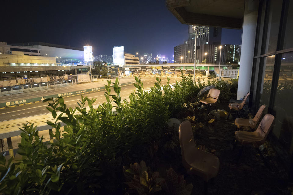 In this Thursday, Nov. 21, 2019, photo, empty chairs used as observation post are seen at the Hong Kong Polytechnic University in Hong Kong. Most of the protesters who took over the university have left following clashes with police, but an unknown number have remained inside, hoping somehow to avoid arrest. (AP Photo/Vincent Thian)