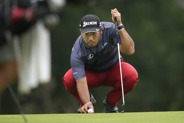 Hideki Matsuyama, of Japan, lines up a putt on the first hole during the first round of the Byron Nelson golf tournament in McKinney, Texas, Thursday, May 11, 2023. (AP Photo/LM Otero)
