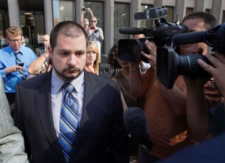 Toronto police officer Constable James Forcillo (L) leaves the court after being let out on bail in Toronto, August 20, 2013. REUTERS/Mark Blinch/File Photo