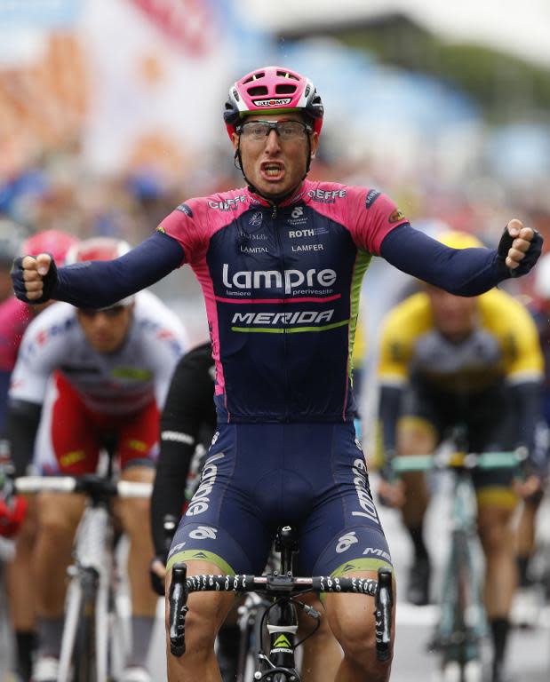 Italian rider Sacha Modolo celebrates as he crosses the finish line to win the 13th stage of the Giro d'Italia on May 22, 2015 in Jesolo