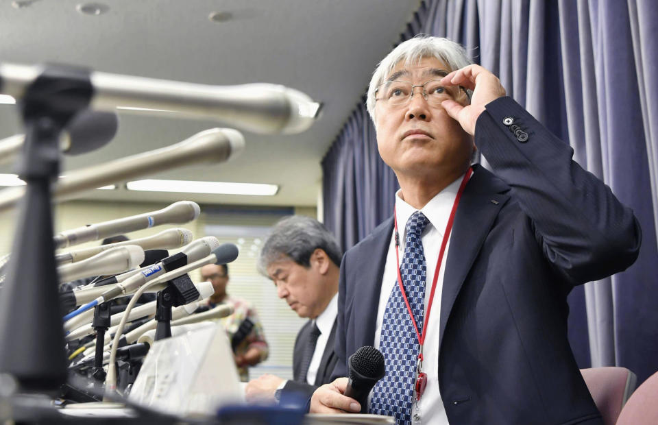 KYB Corp. Senior Managing Executive Officer Keisuke Saito, right and its affiliated firm Kayaba System Machinery Co., Ltd. President Shigeki Hirokado attend a press conference in Tokyo Friday, Oct. 19, 2018. The Japanese government has ordered the company that falsified quality data for earthquake "shock absorbers" used in hundreds of buildings to speed up an investigation and fix any problems quickly. (Yu Nakajima/Kyodo News via AP)