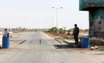 FILE PHOTO: A Syrian soldier stands guard at the Nasib border crossing with Jordan in Deraa, Syria July 7, 2018. REUTERS/ Omar Sanadiki/File Photo