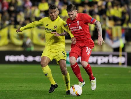 Football Soccer - Villarreal v Liverpool - UEFA Europa League Semi Final First Leg - El Madrigal Stadium, Villarreal, Spain - 28/4/16 Liverpool's Alberto Moreno in action with Villarreal's Jonathan Dos Santos Reuters / Heino Kalis Livepic