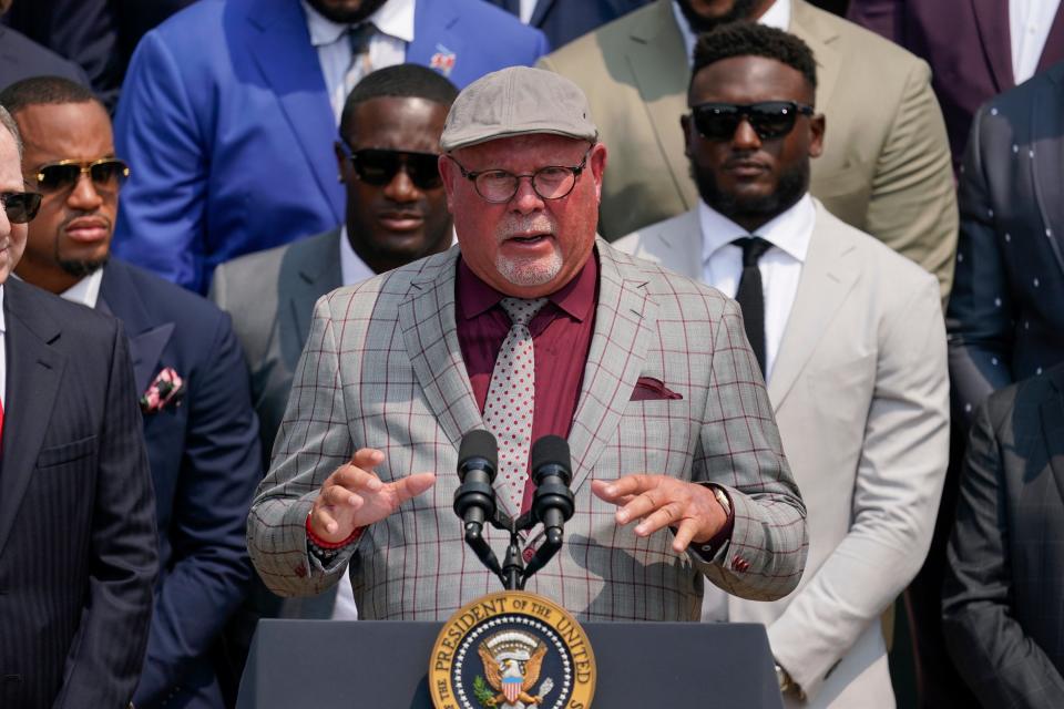 Tampa Bay Buccaneers head coach Bruce Arians, surrounded by members of the Tampa Bay Buccaneers, speaks during a ceremony on the South Lawn of the White House, in Washington, Tuesday, July 20, 2021, where President Joe Biden honored the Super Bowl Champion Tampa Bay Buccaneers for their Super Bowl LV victory. (AP Photo/Andrew Harnik)