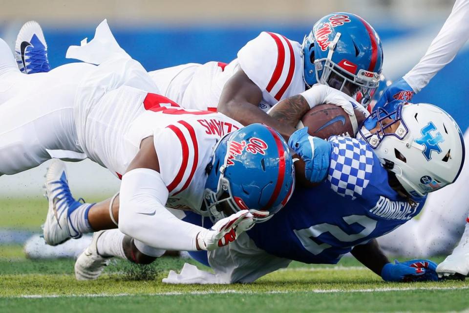 Defensive back Keidron Smith (top) tackled Kentucky running back Chris Rodriguez with the help of Ole Miss teammate Sam Williams during a game in 2020. Smith transferred this offseason to the Wildcats.