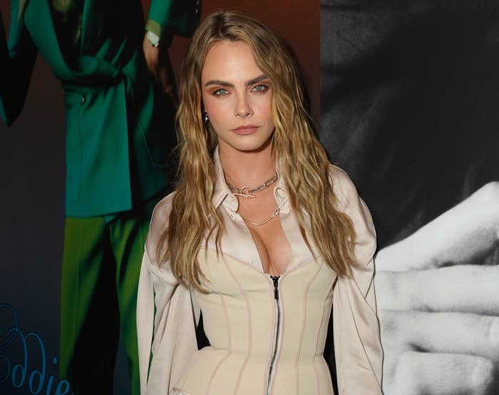 A close-up of Cara in a zipper-front outfit