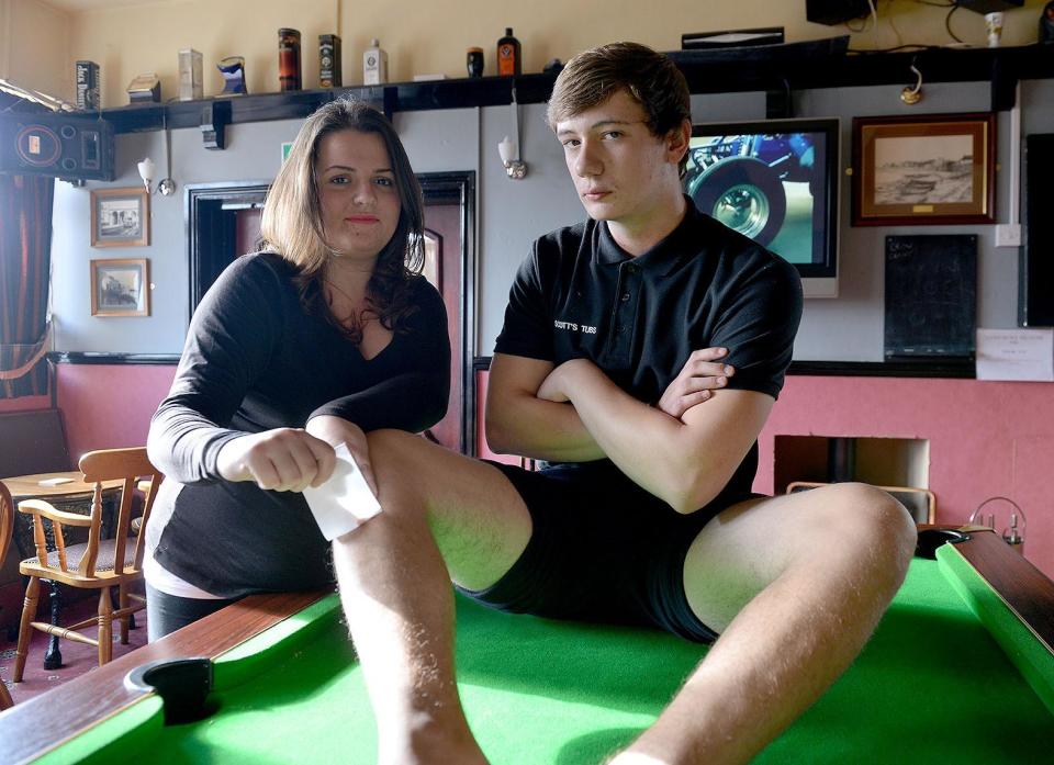 Victoria Arms bar manager Hayley Dennis is about to wax the legs of Scott Noble for charity in 2015. Picture by FRANK REID