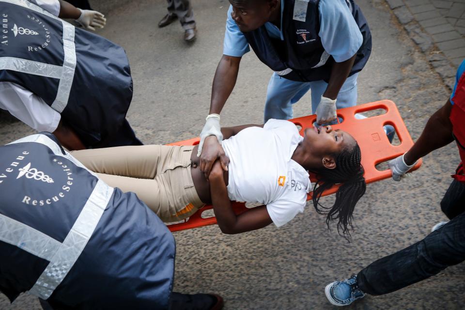 A woman is carried on a stretcher by rescue workers during ongoing gunfire and explosions in Nairobi, Kenya, Jan. 15, 2019. (Photo: Dai Kurokawa/EPA-EFE/REX/Shutterstock)