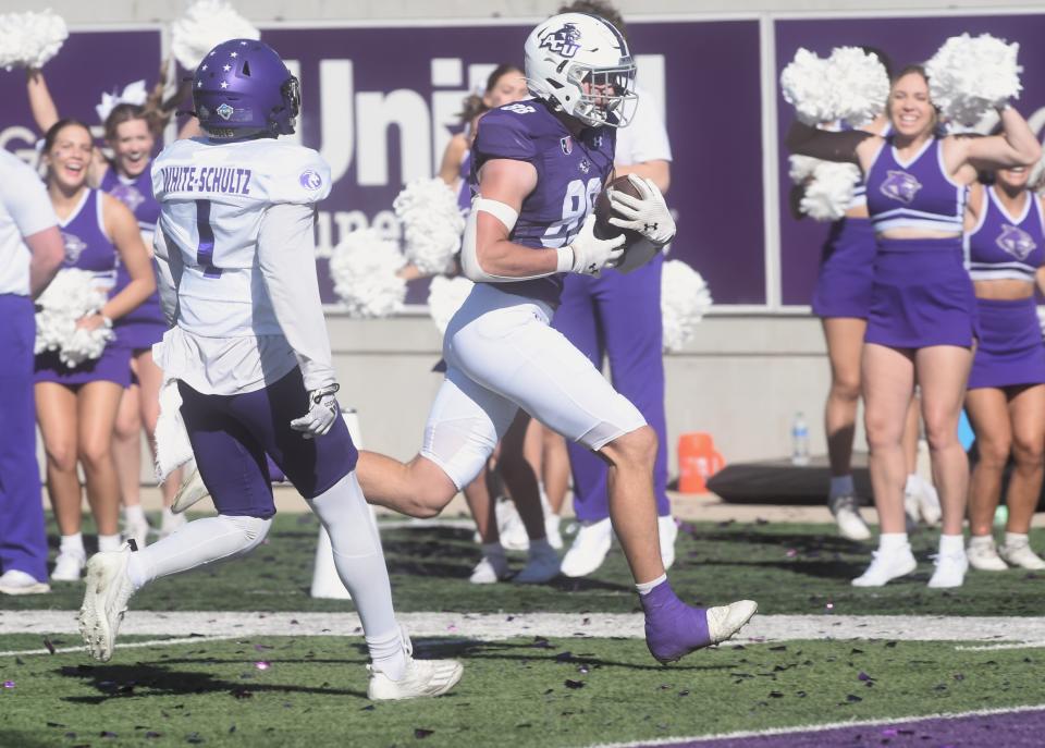 ACU's Jed Castles races toward the end zone as North Alabama's Edwin White Schultz gives chase. It went for a 38-yard TD pass from Maverick McIvor for a 13-0 lead with 2:40 left in the first half. The Wildcats beat North Alabama 30-13 in the United Athletic Conference game Oct. 14 at Wildcat Stadium.