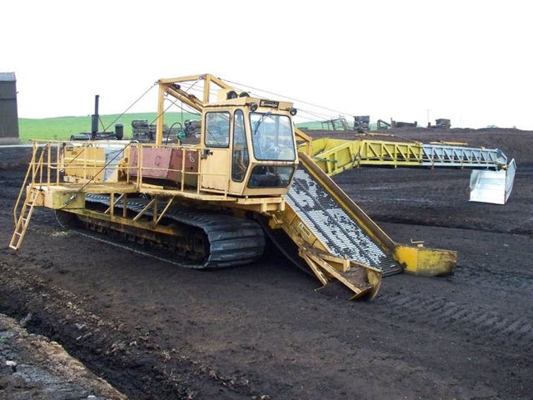 <span class="caption">An industrial peat harvester.</span> <span class="attribution"><a class="link " href="https://www.geograph.org.uk/photo/1242474" rel="nofollow noopener" target="_blank" data-ylk="slk:James T M Towill;elm:context_link;itc:0;sec:content-canvas">James T M Towill</a>, <a class="link " href="http://creativecommons.org/licenses/by-sa/4.0/" rel="nofollow noopener" target="_blank" data-ylk="slk:CC BY-SA;elm:context_link;itc:0;sec:content-canvas">CC BY-SA</a></span>