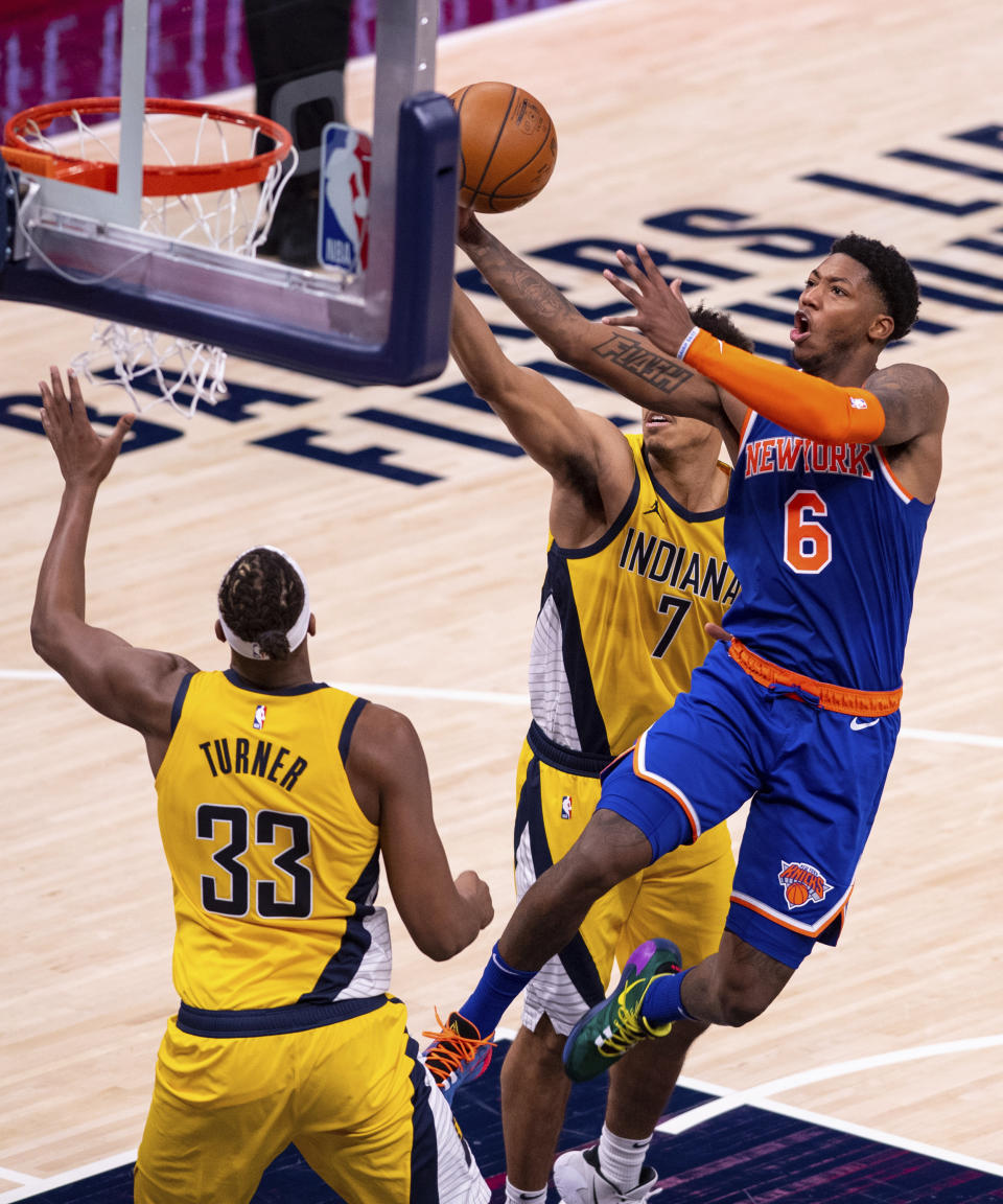 New York Knicks guard Elfrid Payton (6) drives the ball to the basket during the second half of an NBA basketball game against the Indiana Pacers in Indianapolis, Saturday, Jan. 2, 2021. (AP Photo/Doug McSchooler)