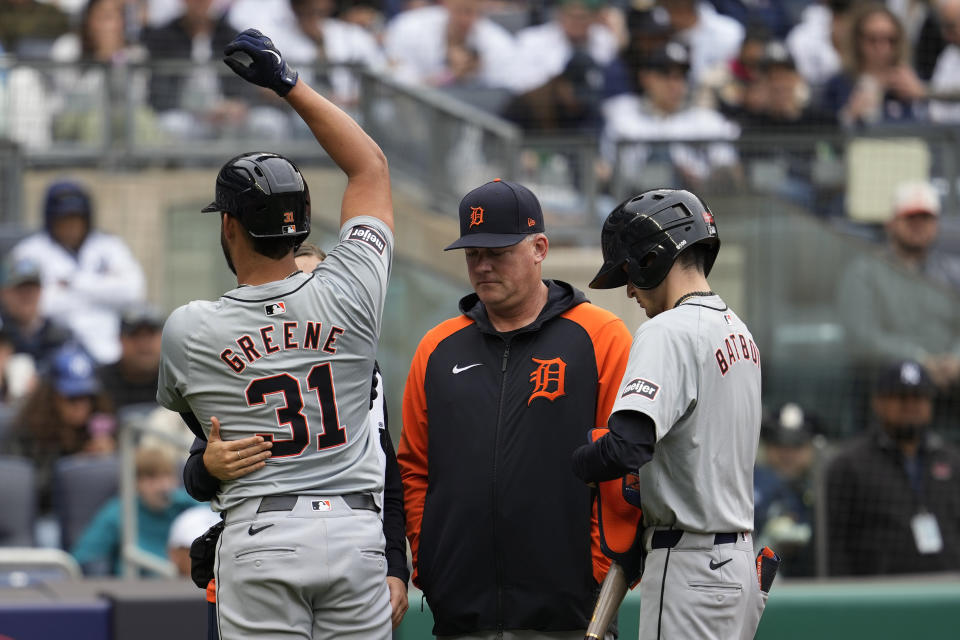 Detroit Tigers manager A.J. Hinch, center, checks on Riley Greene (31) after he was hit by a pitch from New York Yankees pitcher Clarke Schmidt in the fifth inning of a baseball game, Saturday, May 4, 2024, in New York. (AP Photo/Mary Altaffer)