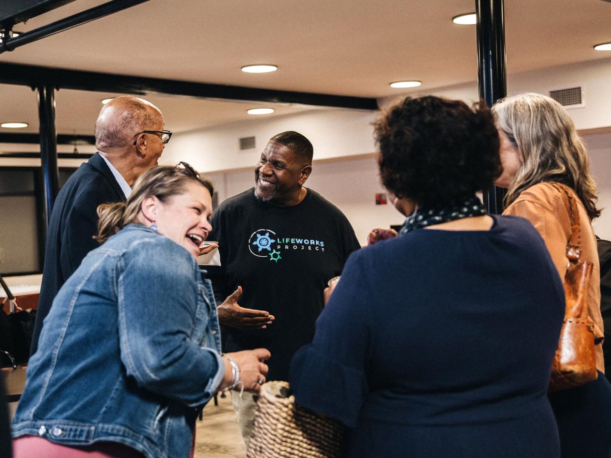 AJ Young of Life Works (center) chats with a group of nonprofit award recipients at the Youth Philanthropy Grants Celebration at the Staunton Innovation Hub earlier this year.