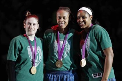 Lynx teammates Lindsay Whalen, left, Seimone Augustus, and Maya Moore won gold together at the 2012 London Olympics. (AP)