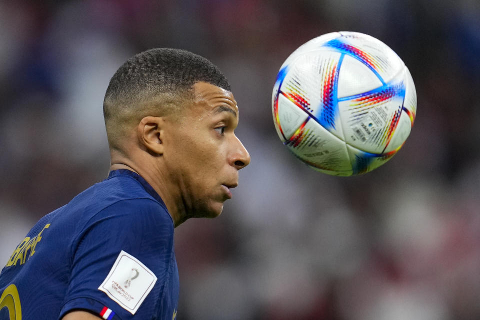 France's Kylian Mbappe attempts to control the ball during the World Cup quarterfinal soccer match between England and France, at the Al Bayt Stadium in Al Khor, Qatar, Saturday, Dec. 10, 2022. (AP Photo/Natacha Pisarenko)