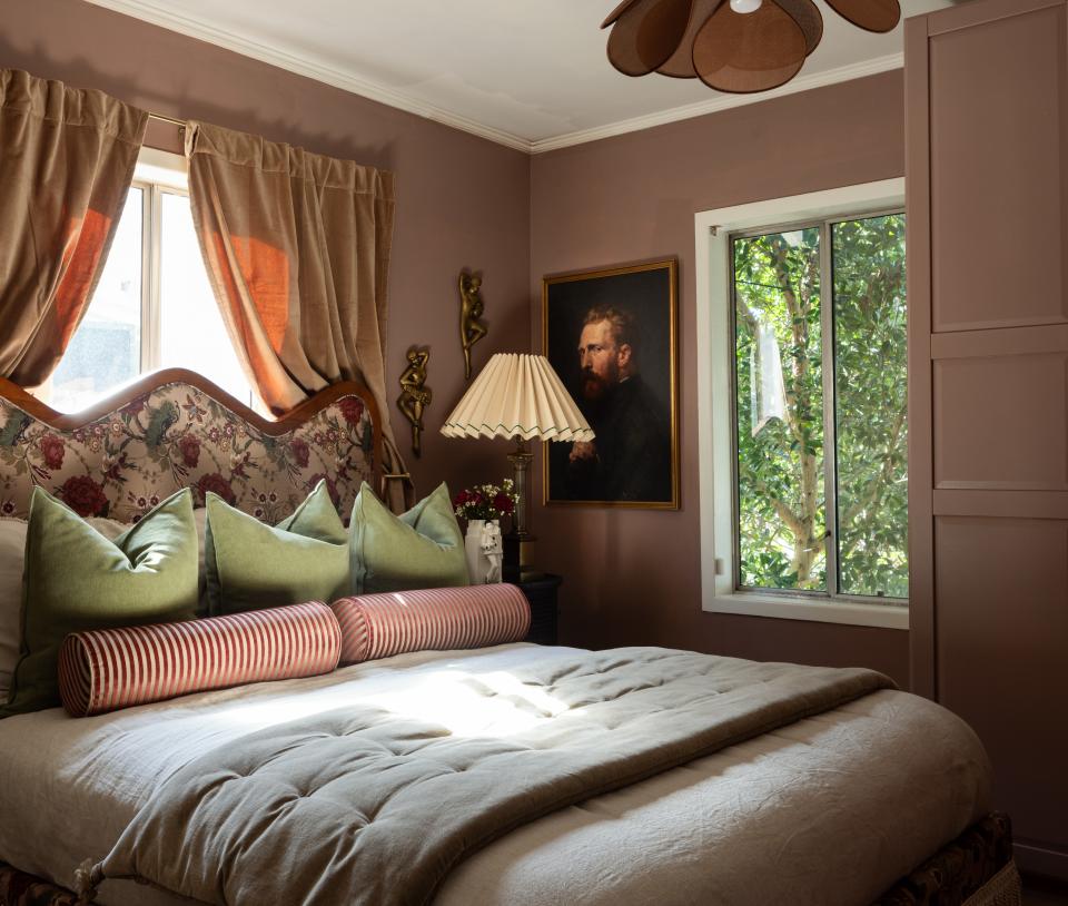 Francesca decided to turn the rear bedroom into a closet. “I still wanted it to be a functional guest room, so I had to lose a neighbor-facing window. I normally would never cover any natural light, but this was a tricky situation,” she says. The walls wear a coat of Farrow & Ball’s Sulking Room Pink. The Estelle bed frame is from Francesca’s own furniture line.