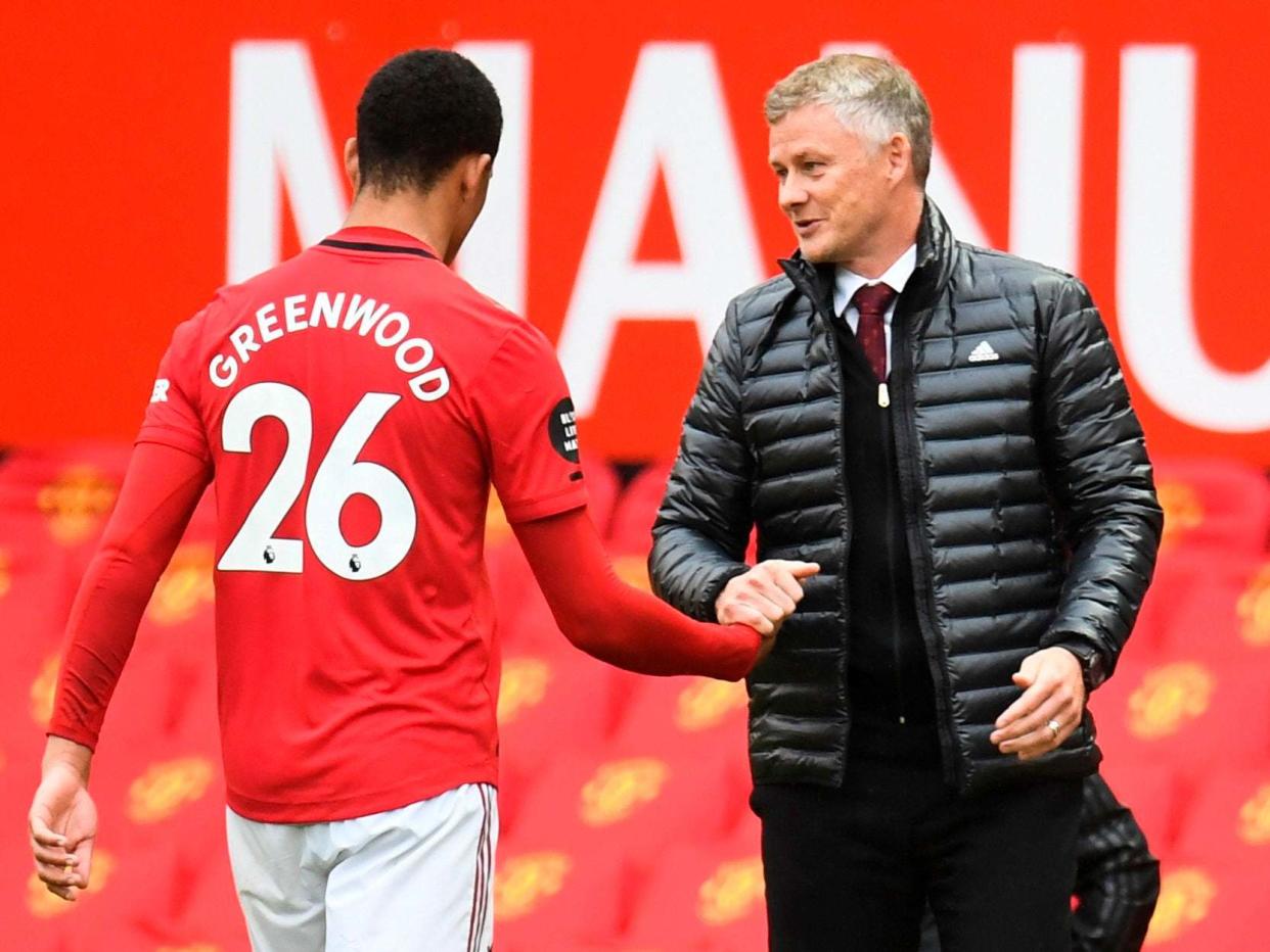 Mason Greenwood is congratulated by Manchester United manager Ole Gunnar Solskjaer: Getty