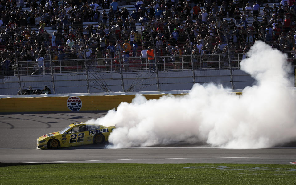 Joey Logano (22) does a burnout after winning a NASCAR Cup Series auto race at Las Vegas Motor Speedway, Sunday, March 3, 2019, in Las Vegas. (AP Photo/John Locher)