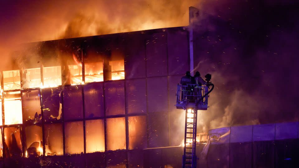 Firefighters respond to the burning Crocus City Hall on March 22. - Maxim Shemetov/Reuters