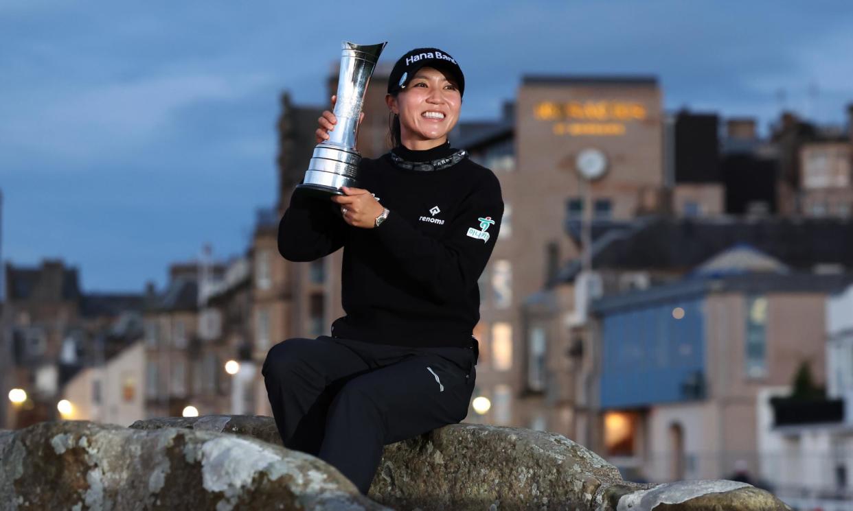 <span>Lydia Ko poses with the AIG Women’s Open trophy on St Andrews’ famous Swilcan Bridge.</span><span>Photograph: Ross Parker/R&A/Getty Images</span>