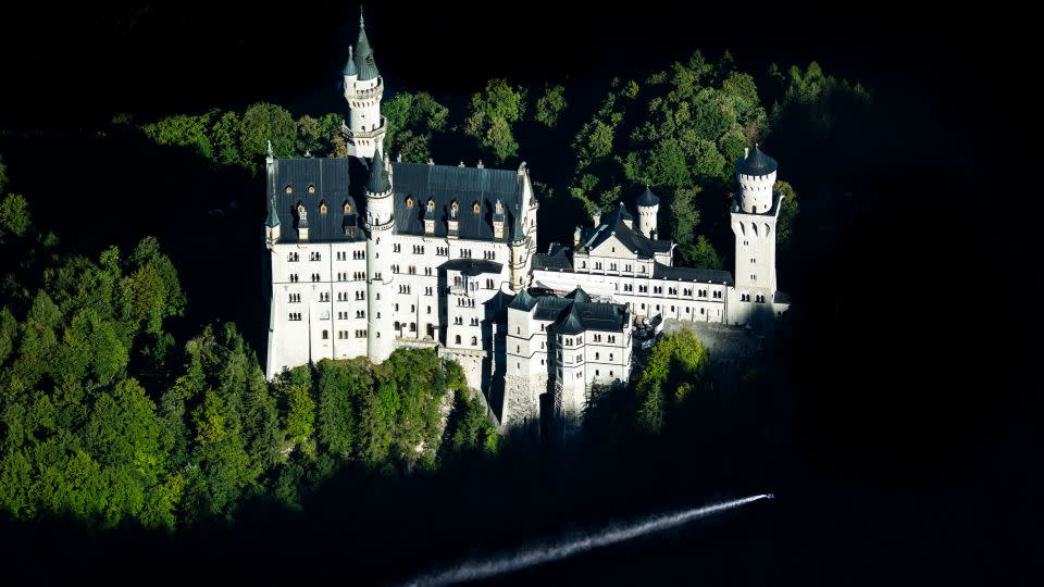 Max Manow flew past Neuschwanstein Castle in Bavaria in a wingsuit. - Joerg Mitter/RDBLP/Red Bull/AP