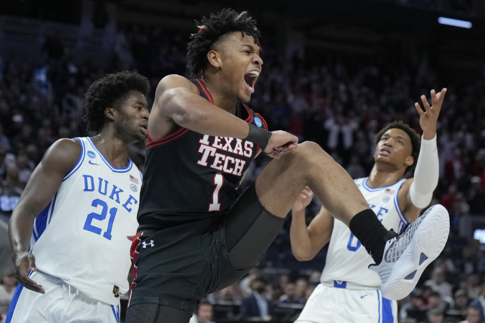 FILE - Texas Tech guard Terrence Shannon Jr. (1) reacts after dunking against Duke forward AJ Griffin (21) and forward Wendell Moore Jr. during the first half of a college basketball game in the Sweet 16 round of the NCAA tournament in San Francisco, Thursday, March 24, 2022. The Illini were big winners in the offseason transfer market though, securing the talents of former Texas Tech wing Terrence Shannon Jr. and Baylor forward Matthew Mayer. (AP Photo/Tony Avelar, File)