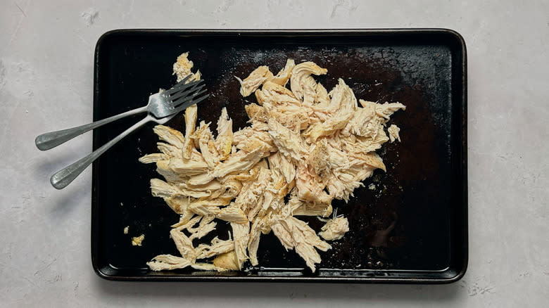 shredded chicken on sheet tray