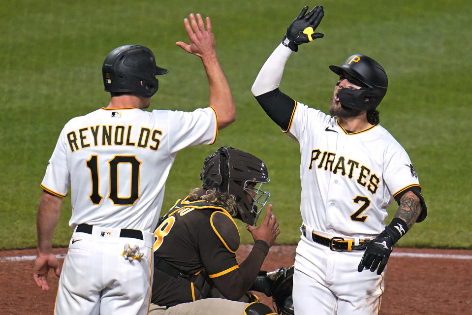 Pittsburgh Pirates' Michael Chavis (2) celebrates with Bryan Reynolds (10) after hitting a two-run home run off San Diego Padres relief pitcher Steven Wilson during the eighth inning of a baseball game in Pittsburgh, Saturday, April 30, 2022. (AP Photo/Gene J. Puskar)