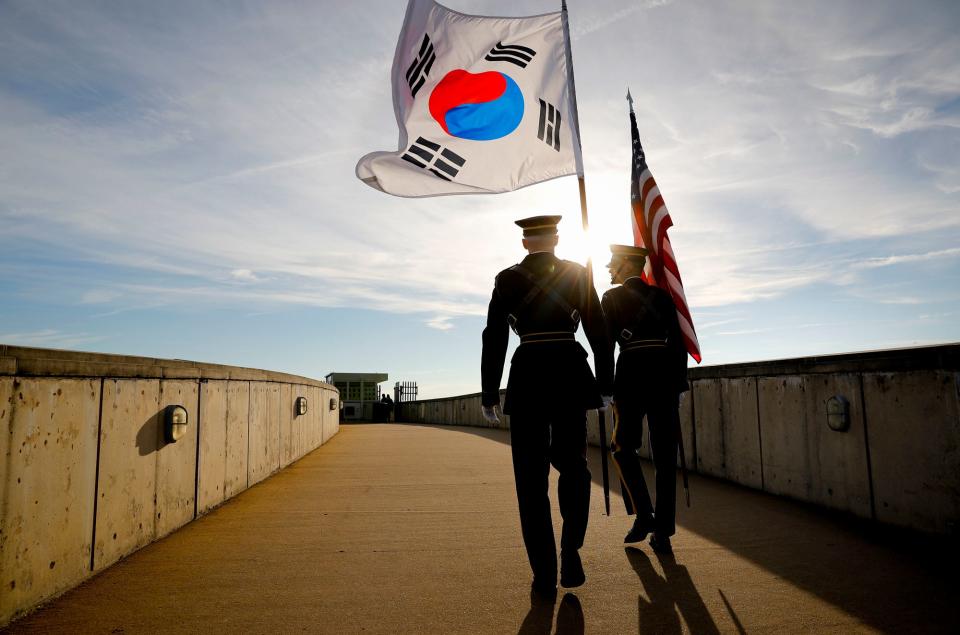 Members of the Honor Guard carry U.S. and South Korea flags after participating in the 2018 Security Consultative at the Pentagon, co-hosted by Defense Secretary Jim Mattis and South Korea Minister of Defense Jeong Kyeong-doo, Wednesday, Oct. 31, 2018. (AP Photo/Pablo Martinez Monsivais)