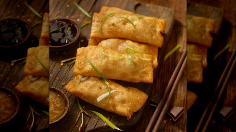 Egg rolls on wooden board