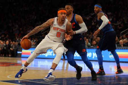 Dec 16, 2017; New York, NY, USA; New York Knicks small forward Michael Beasley (8) drives against Oklahoma City Thunder point guard Russell Westbrook (0) and forward Carmelo Anthony (7) during the third quarter at Madison Square Garden. Mandatory Credit: Brad Penner-USA TODAY Sports