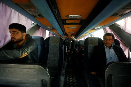 Passengers sit inside a bus in Qamishli city in Syria's Kurdish-held northeast to travel to government-controlled Aleppo, Syria May 7, 2017. REUTERS/Rodi Said