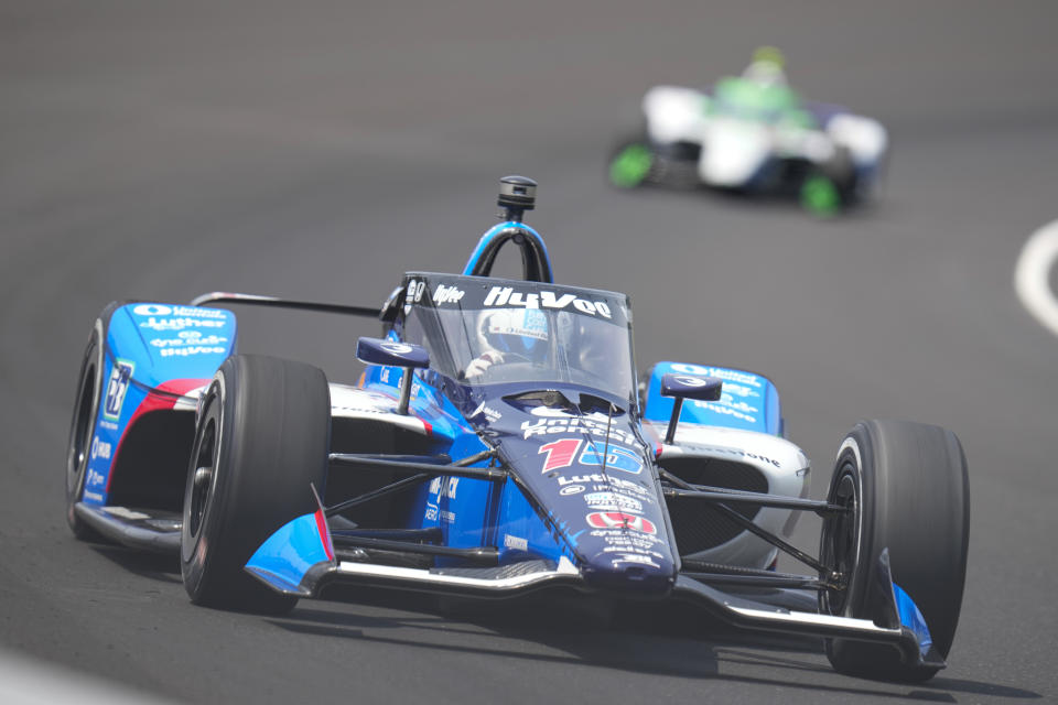 Graham Rahal drives through the first turn during practice for the Indianapolis 500 auto race at Indianapolis Motor Speedway in Indianapolis, Thursday, May 18, 2023. (AP Photo/Michael Conroy)