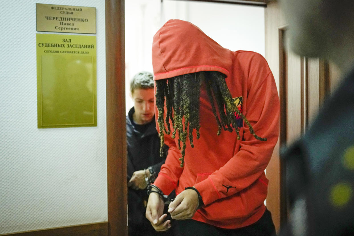 WNBA star and two-time Olympic gold medalist Brittney Griner leaves a courtroom after a hearing, in Khimki just outside Moscow, Russia, Friday, May 13, 2022. Griner, a two-time Olympic gold medalist, was detained at the Moscow airport in February after vape cartridges containing oil derived from cannabis were allegedly found in her luggage, which could carry a maximum penalty of 10 years in prison.  (AP Photo/Alexander Zemlianichenko)